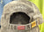 Black cap with 'HAWAII' text and a flag emblem on a blurred background