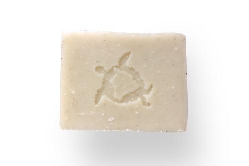 a light colored lime and mint soap with rosemary and fir needle.