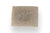 an orange and lemongrass soap with papaya seeds